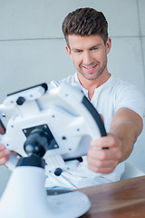 Image showing Handsome Middle Age Man Playing Cool Gadget