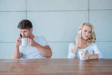 Image showing Couple both using their mobile phones