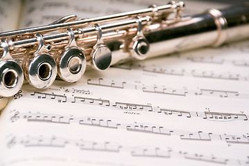 Image showing Flute across a musical score