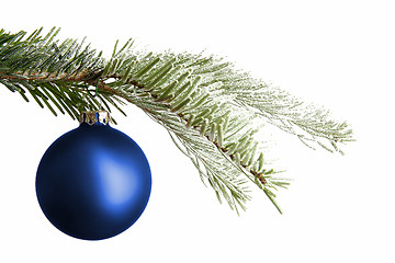 Image showing Blue Christmas ball on a snowy branch