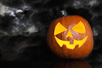 Image showing Pumpkin on a black cloudy background for Halloween