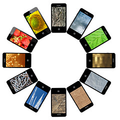 Image showing Modern mobile phones with different images