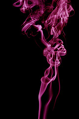 Image showing Purple smoke on black background