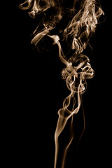 Image showing Golden smoke on black background