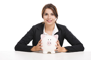 Image showing Businesswoman with a piggy bank