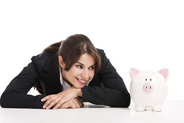 Image showing Businesswoman with a piggy bank