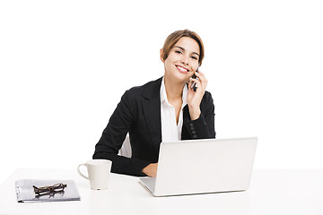 Image showing Businesswoman answering phone