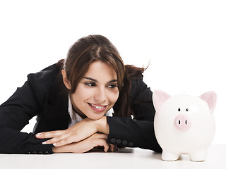 Image showing Businesswoman with a piggy bank