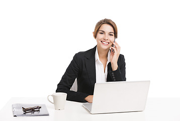 Image showing Businesswoman answering phone