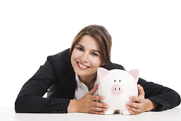 Image showing Businesswoman with a piggy bank