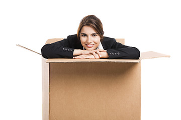 Image showing Business woman appear inside a big card box