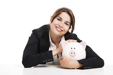 Image showing Businesswoman with a piggy bank