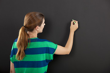 Image showing Writing on a chalkboard