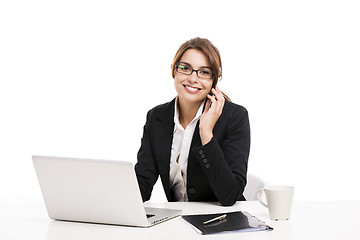 Image showing Businesswoman answering phone