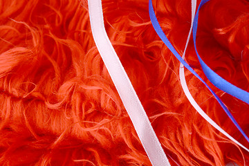 Image showing Red background with white and blue ribbon