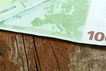 Image showing Close-up of  100 Euro banknotes isolated on white background.