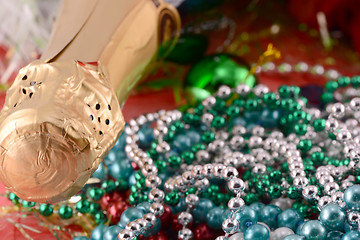 Image showing Beautiful ornaments, champagne, pearl and balls as a New Year decoration