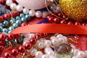 Image showing String of pearls on red background