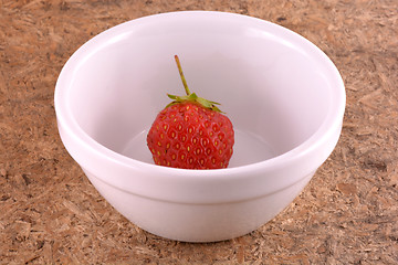 Image showing Fresh ripe strawberries on a vintage wooden background