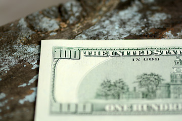 Image showing Hundreds of US dollars on old wooden background
