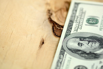 Image showing American 100 U.S. dollars on wooden background