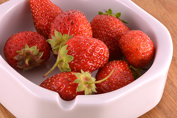 Image showing Fresh ripe strawberries on a vintage wooden background