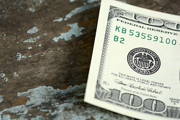 Image showing Hundreds of US dollars on old wooden background