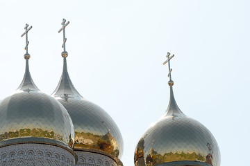 Image showing Golden cupola and christian cross on church against blue sky