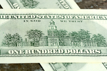 Image showing One hundred dollars on wood background