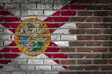 Image showing Brick wall texture with flag