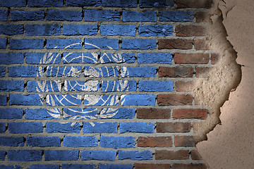 Image showing Dark brick wall with plaster - United Nations