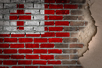 Image showing Dark brick wall with plaster - Tonga