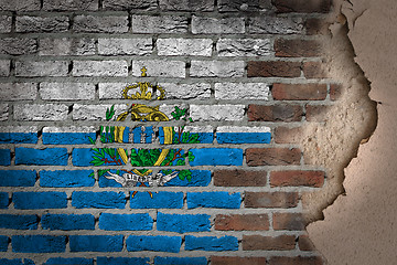 Image showing Dark brick wall with plaster - San Marino