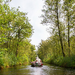 Image showing Boat with unrecognisable people in the Weerribben