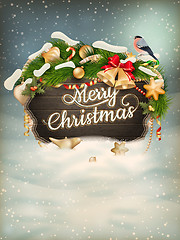 Image showing Wooden banner with Christmas Fur-tree branches.