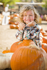 Image showing Cute Little Boy Gives Thumbs Up at Pumpkin Patch