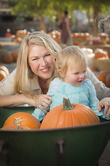 Image showing Young Mother and Daughter Enjoys the Pumpkin Patch