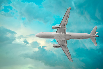 Image showing Passenger airplane in the beautiful cumulus clouds