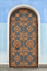 Image showing Old building door decorated with golden ornaments