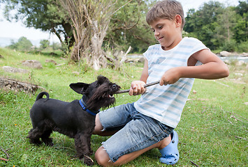 Image showing Boy and dog