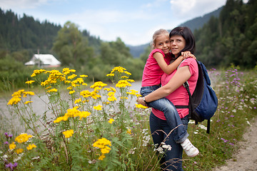 Image showing Mother holds daughter on hands