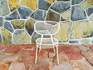 Image showing White chair on colorful tile background