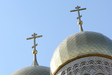 Image showing Golden cupola and christian cross on church against blue sky