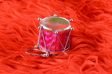 Image showing Christmas toy drum isolated on red background