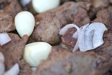 Image showing macro food, garlic on fried liver