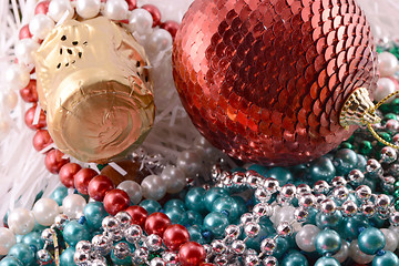 Image showing Beautiful ornaments, champagne, pearl and balls as a New Year decoration