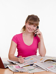 Image showing Girl talking about the services on an ad