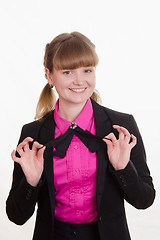Image showing Girl holding a butterfly on shirt