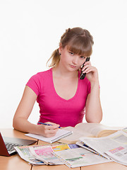 Image showing Girl seriously talking on the phone