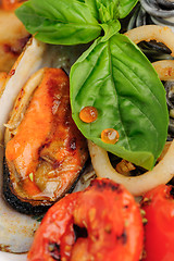 Image showing Black Pasta with sea food and basil